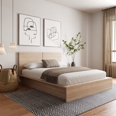 Modern wooden platform bed in a minimalist bedroom with neutral decor and natural light