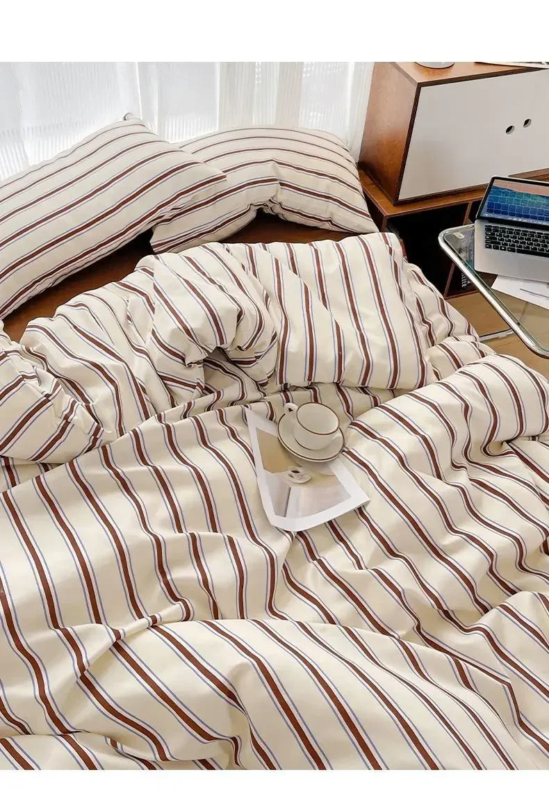 Simple Red and Blue Striped Duvet Cover and Four Piece Bed Sheet Set with Washed Cotton Bedding on the Bed